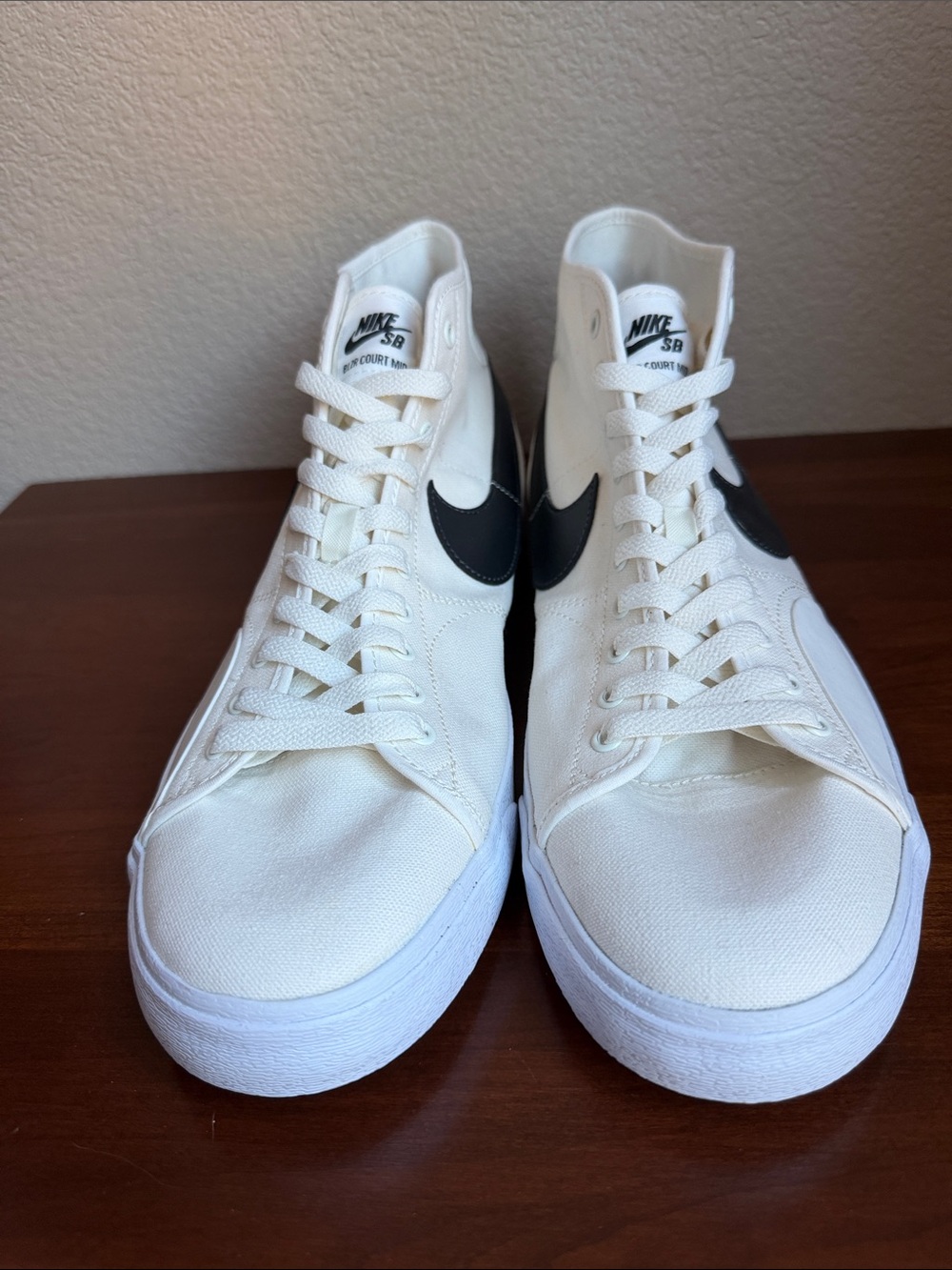 Nike White High-Top Sneakers with Black Swoosh